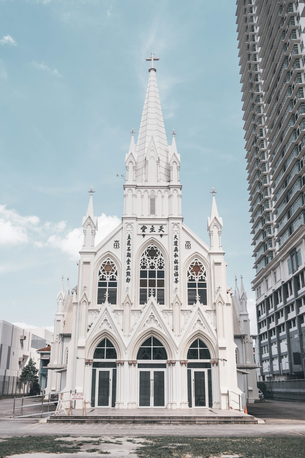 a large white church with a cross on top of it