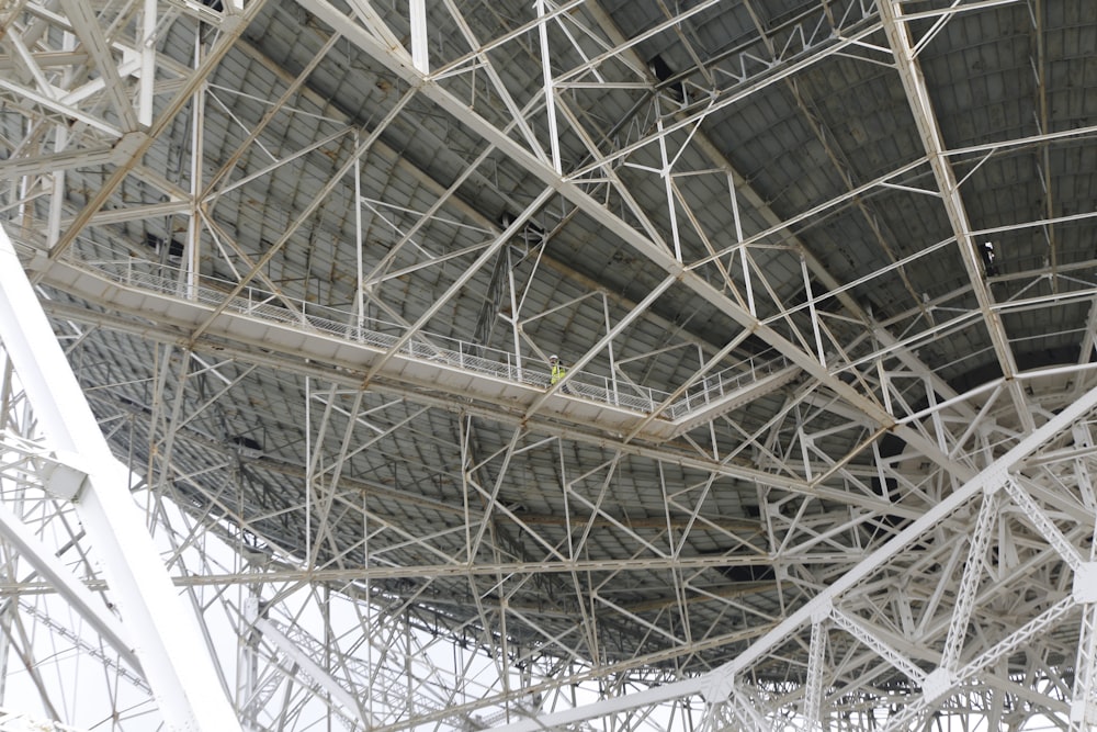 a large metal structure with scaffolding on top of it