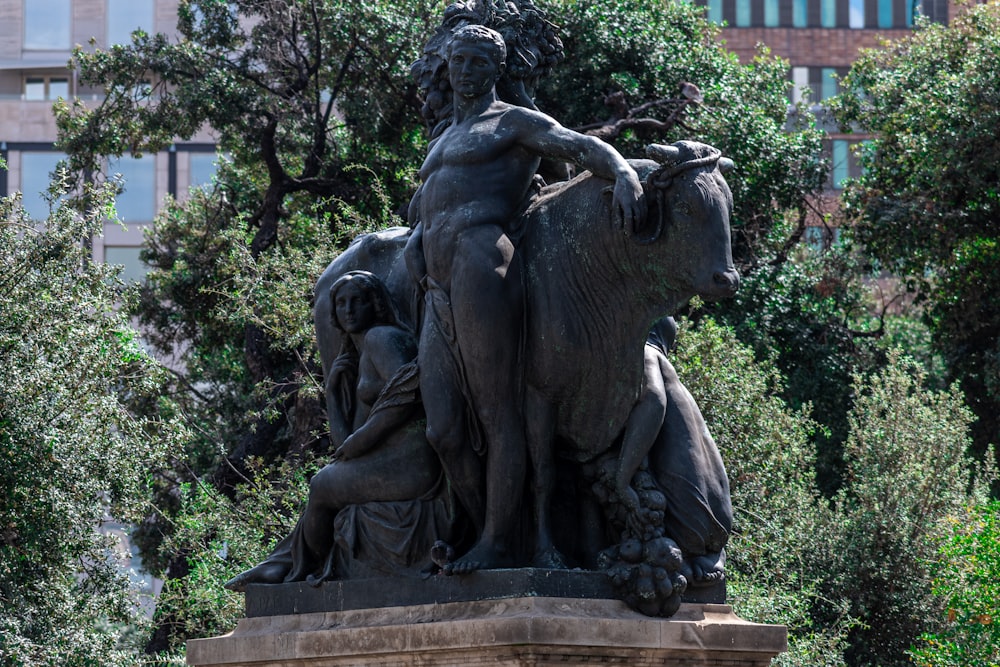 a statue of a man riding an elephant