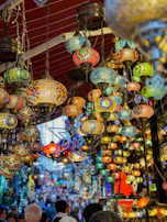Colorful market scenes in Marrakech, full of spices, textiles, and lanterns.