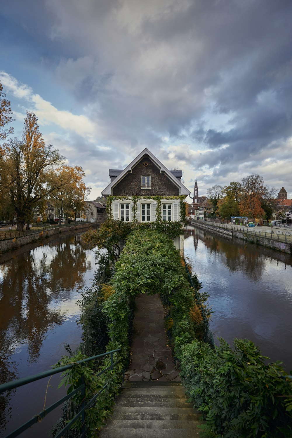 a house sitting on the side of a river