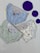 Three pairs of children's underwear are laid out on a flat surface. The underwear has playful designs featuring cartoon characters and patterns. There are three large purple circles placed next to the underwear.