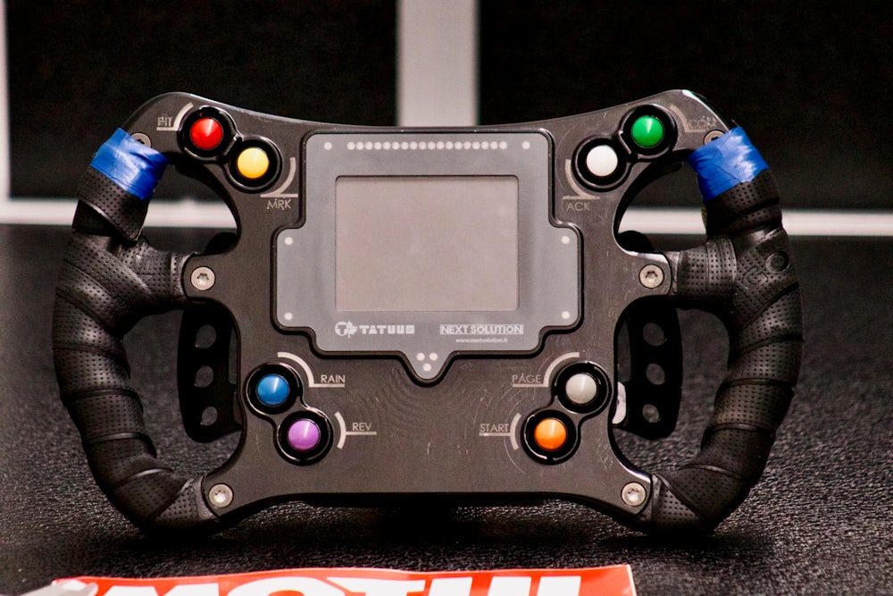 a close up of a steering wheel on a table