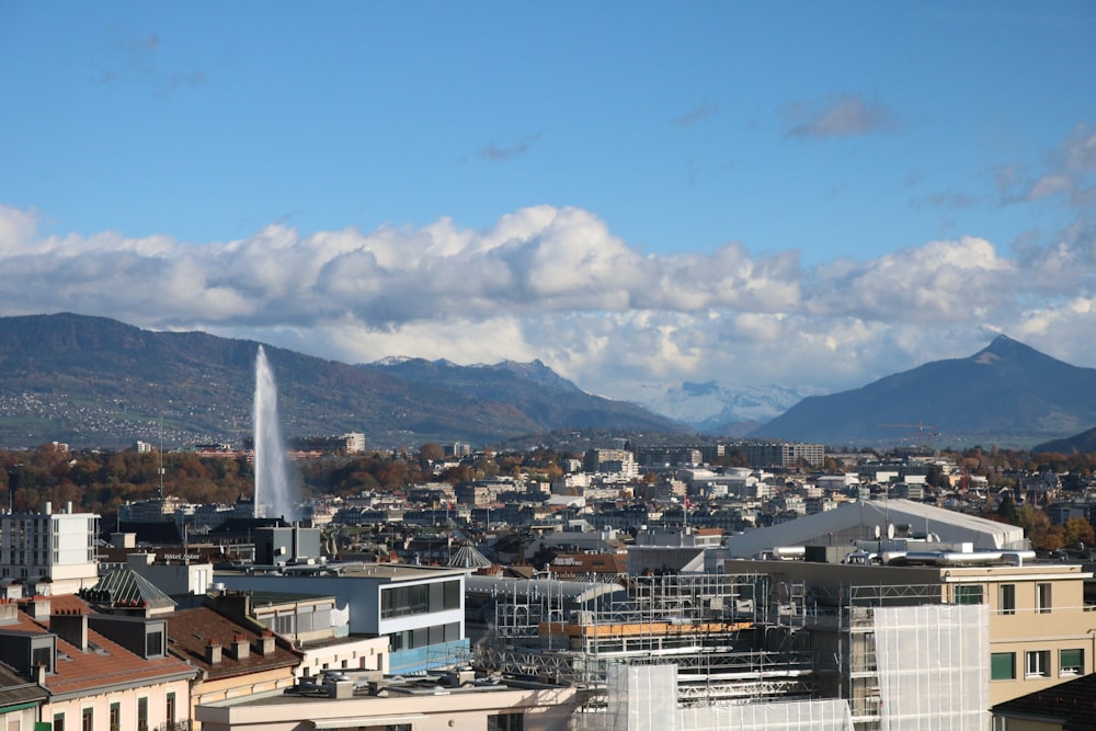 a view of a city with mountains in the background