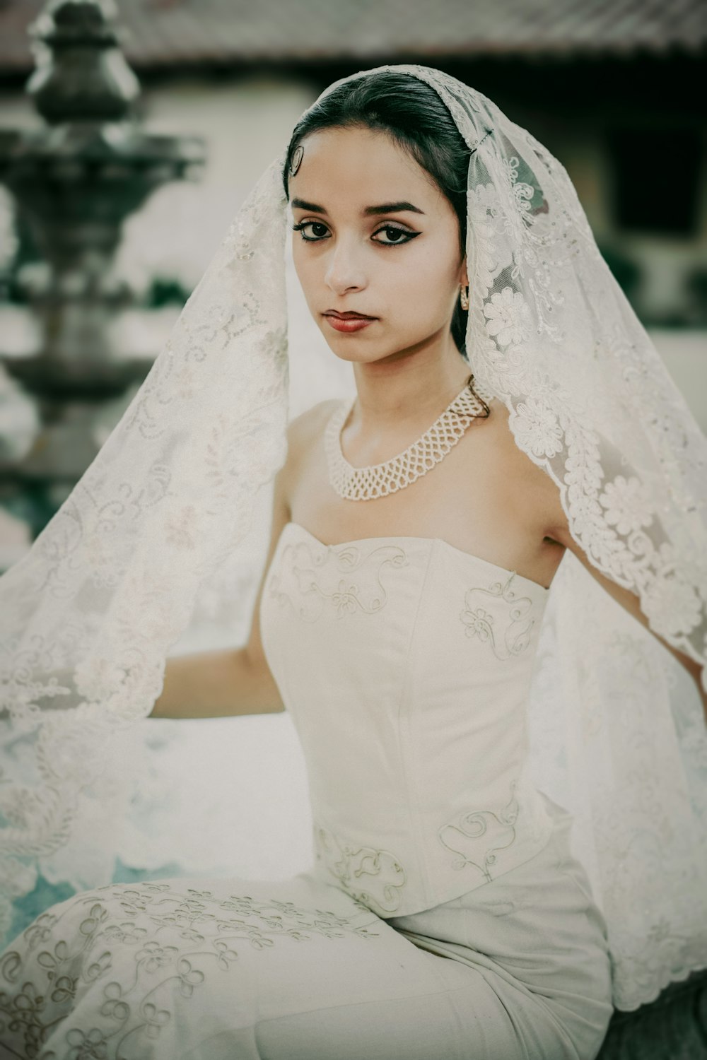 a woman in a wedding dress and veil