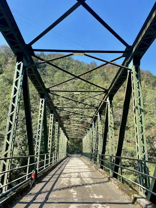 a view of a bridge from the bottom of it