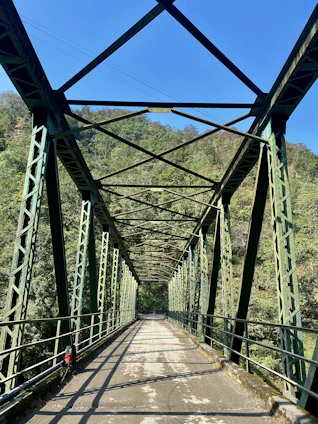 a view of a bridge from the bottom of it