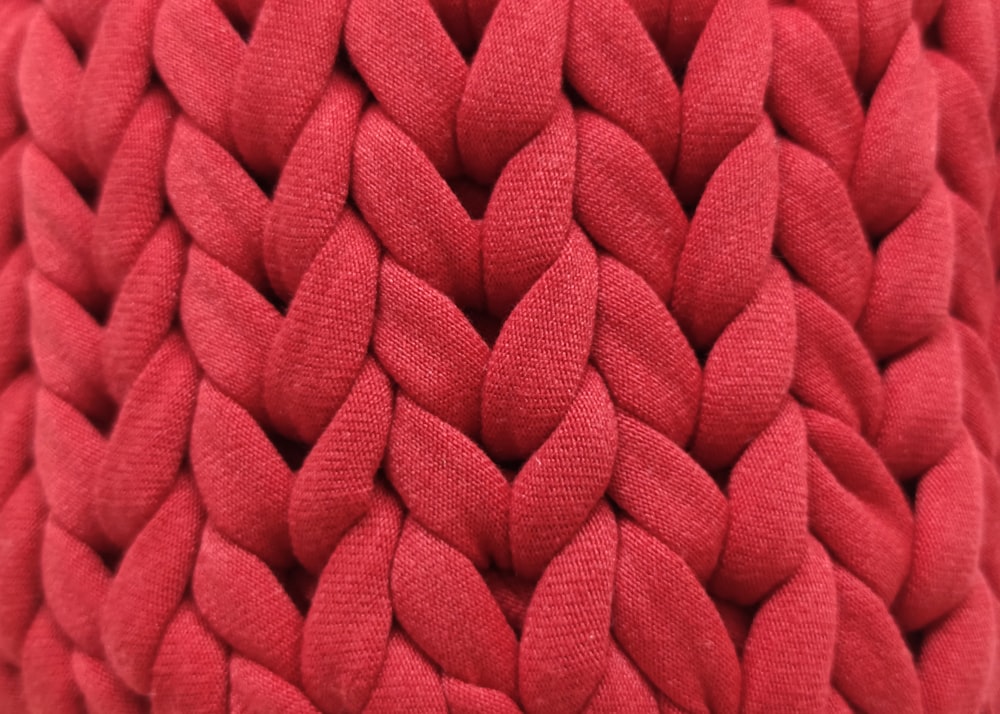 a close up view of a red pillow