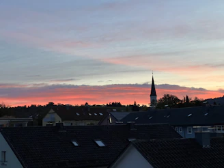 A peaceful sunset over a small town, symbolizing calm and reflection.