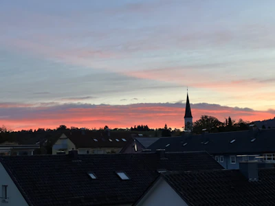 A peaceful sunset over a small town, symbolizing calm and reflection.