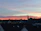 A serene sunset over a quiet town, symbolizing hope and fulfilled wishes.