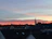 A serene sunset over a quiet town, symbolizing hope and fulfilled wishes.