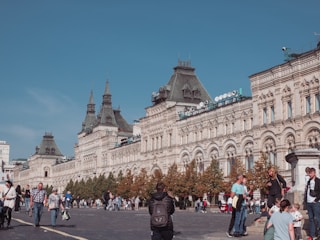 A bustling Kentucky town square with locals engaging in daily activities under a clear blue sky.
