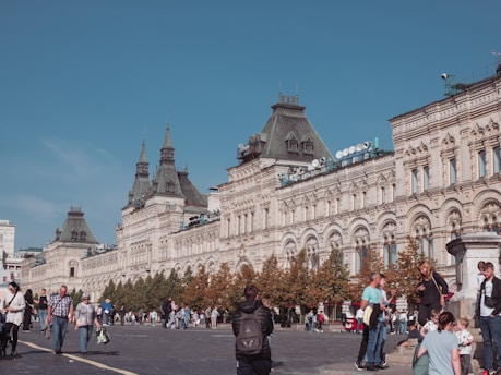 A bustling Kentucky town square with locals engaging in daily activities under a clear blue sky.