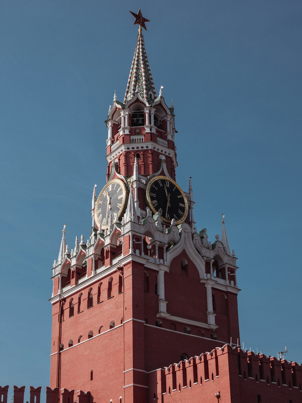 a large clock tower with a star on top