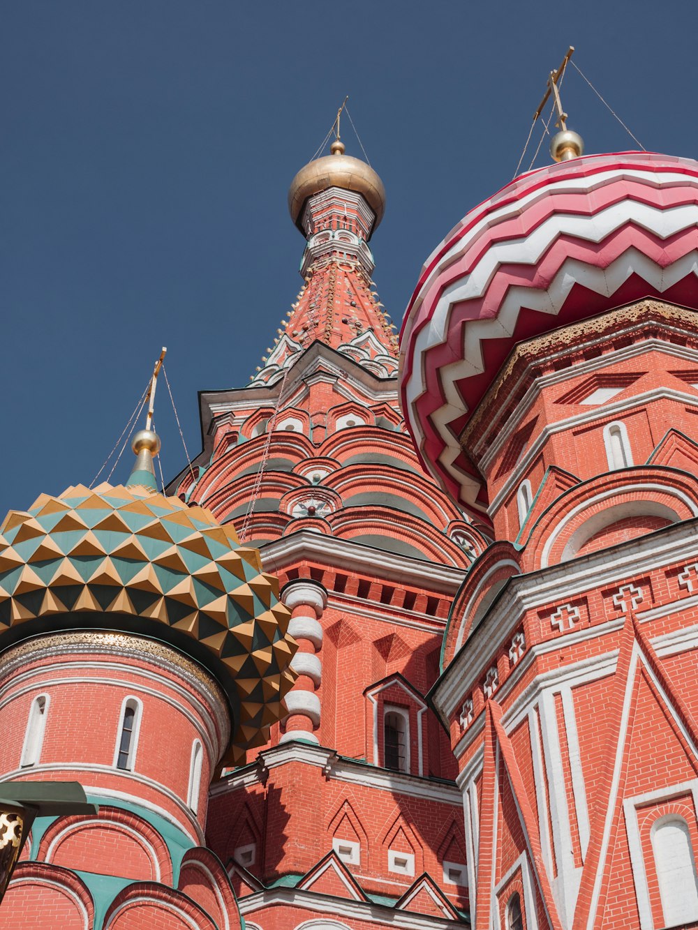 a large red building with a dome on top of it