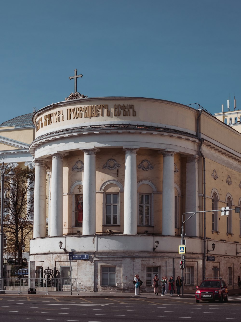 a large building with a cross on top of it