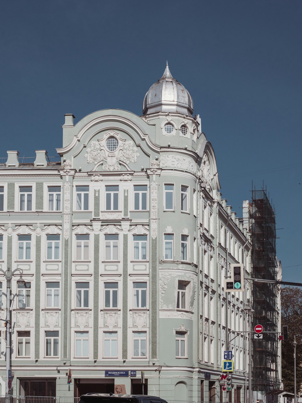 a large white building on the corner of a street