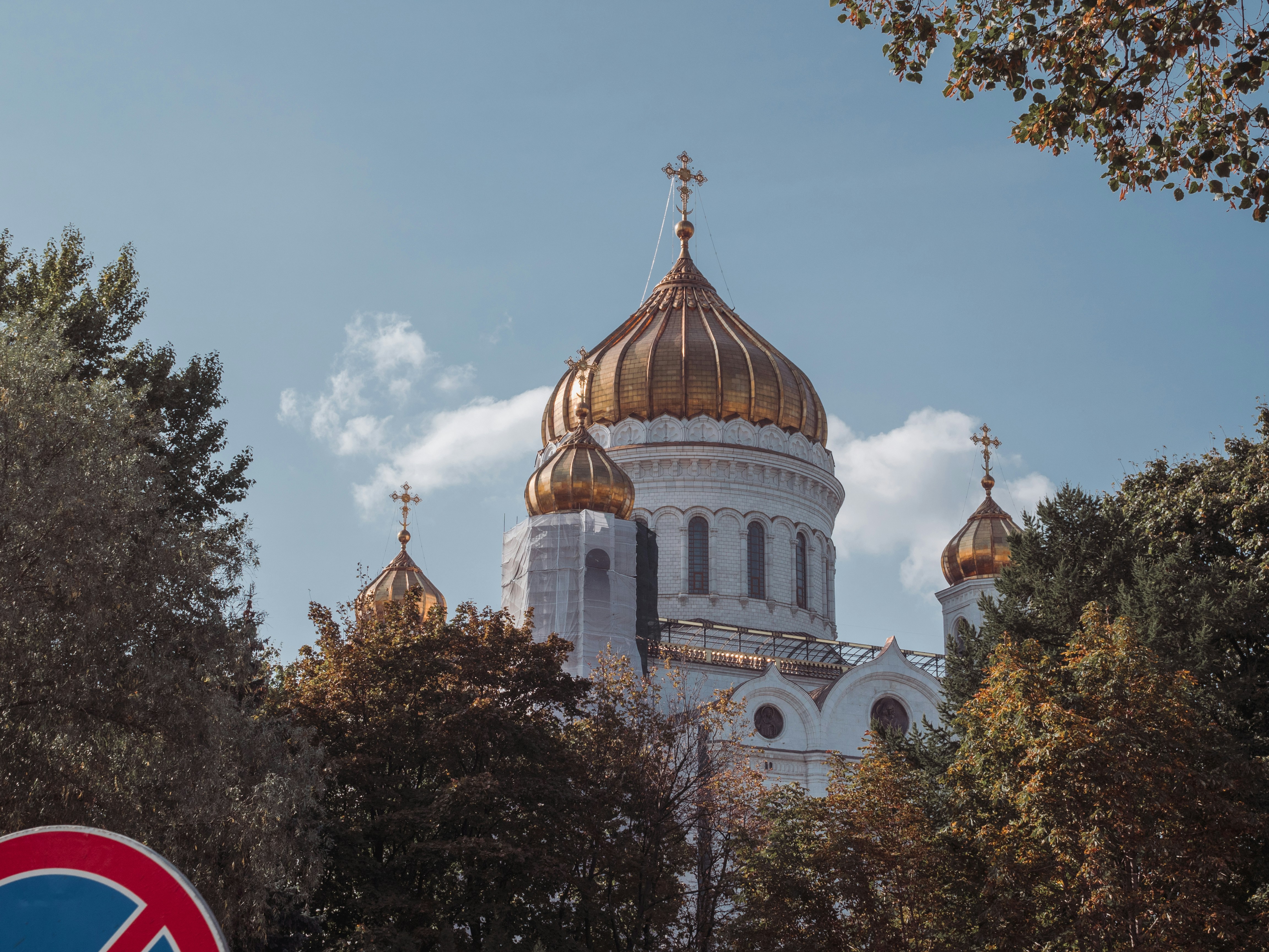 a large white building with a gold dome