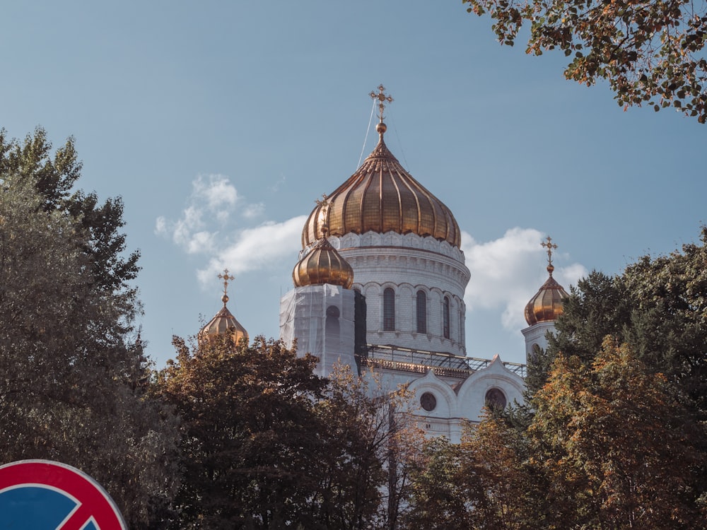 a large white building with a gold dome