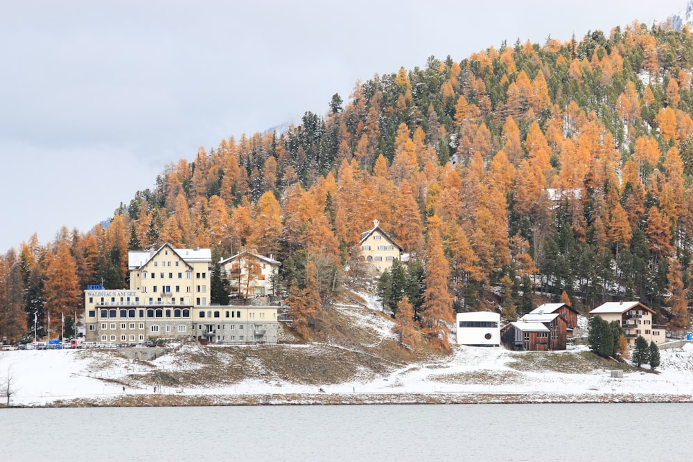 a large building sitting on top of a snow covered hillside