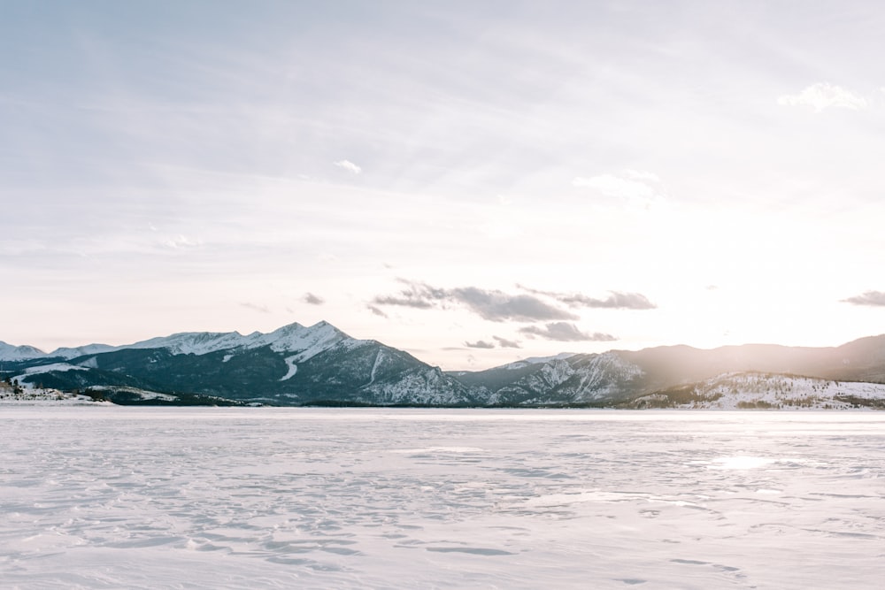 a person riding skis on a snowy surface