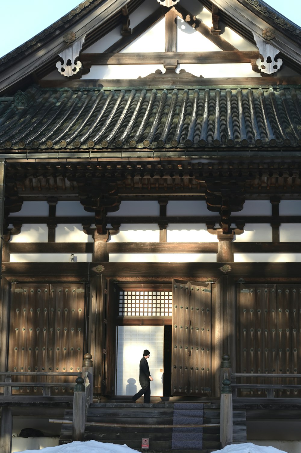 a man standing in a doorway of a building