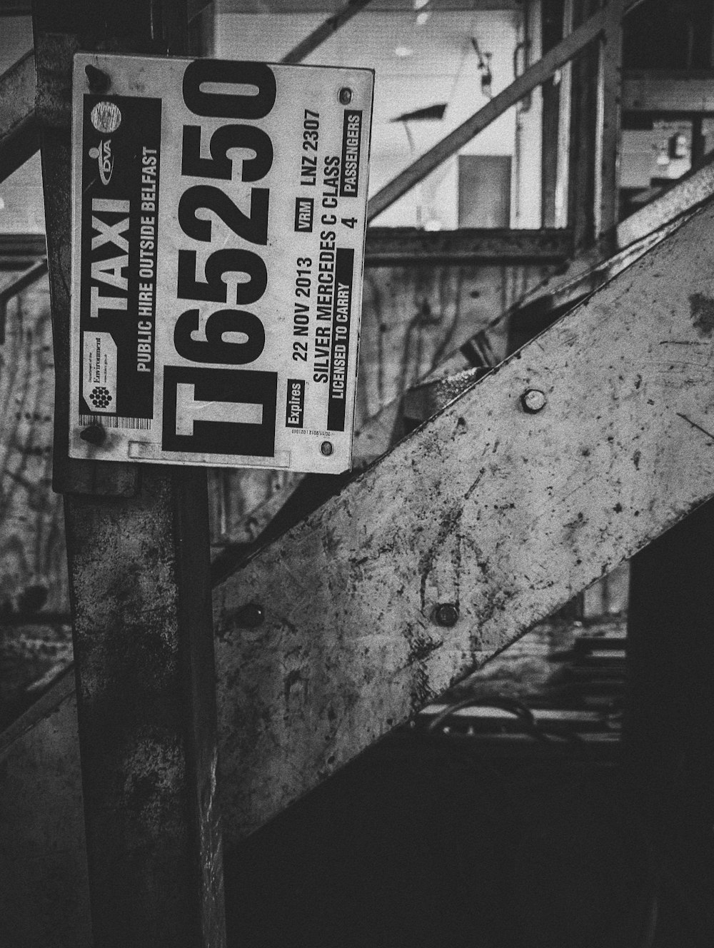 a black and white photo of a street sign