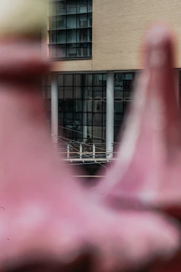 An outdoor scene of a modern building, representing the real estate sector.