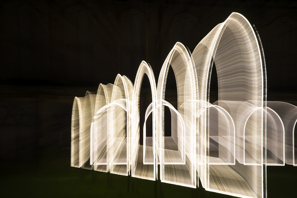 a group of arches that are lit up in the dark