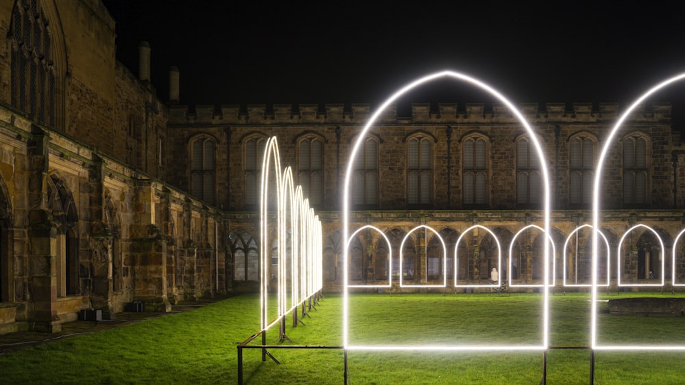 a large building with arches and arches lit up at night