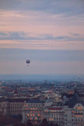 A panoramic view of Seoul’s skyline at dusk with glowing lanterns floating in the sky.