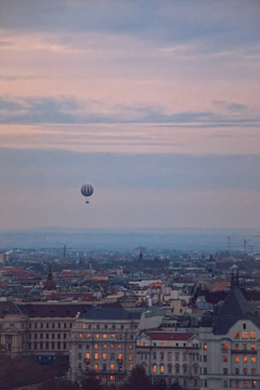 A panoramic view of Seoul’s skyline at dusk with glowing lanterns floating in the sky.
