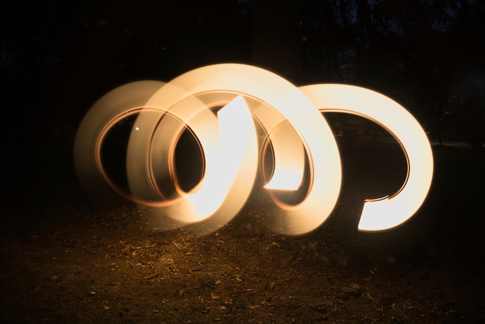 a group of circular lights sitting on top of a field