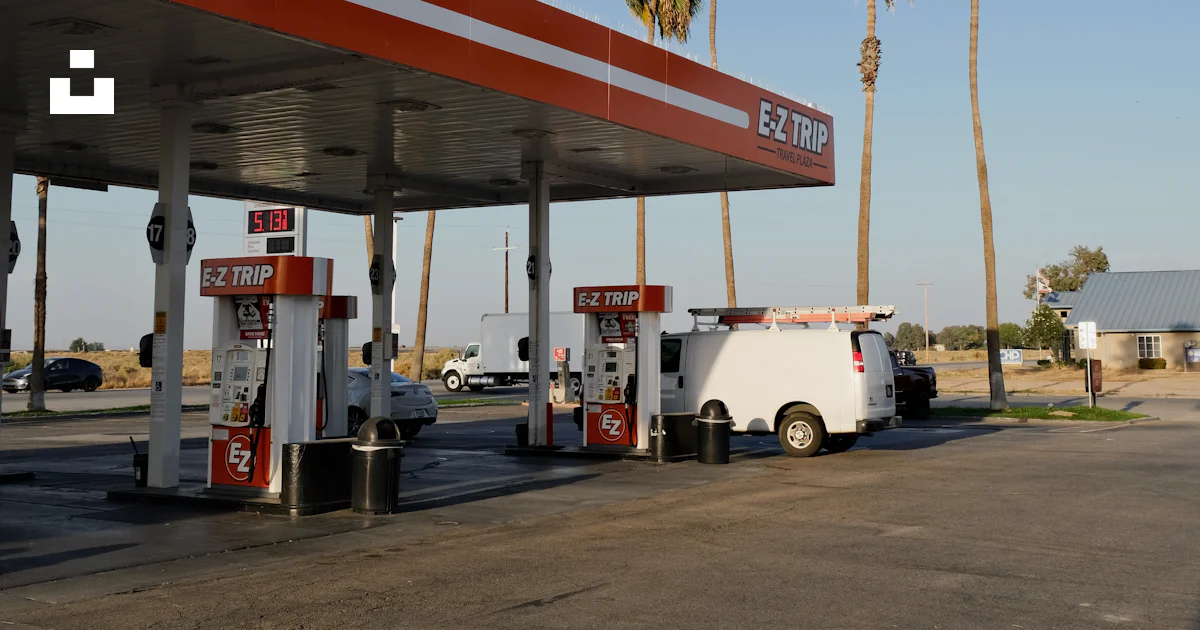 A gas station with palm trees in the background photo – Free California ...