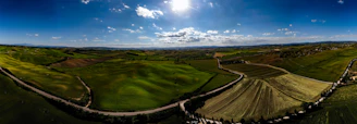 A panoramic view of Siliana’s rolling hills under a bright blue sky.