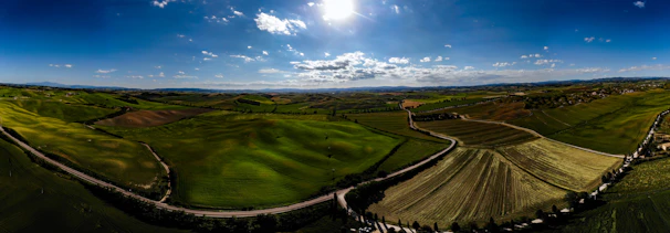 A panoramic view of Siliana’s rolling hills under a bright blue sky.