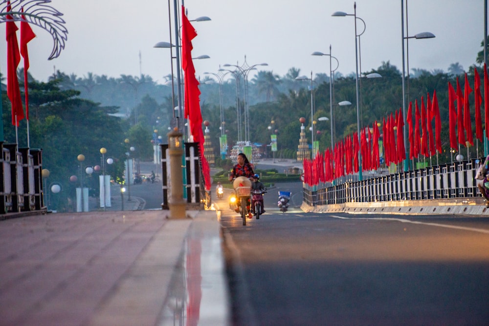 a person riding a motorcycle down a street