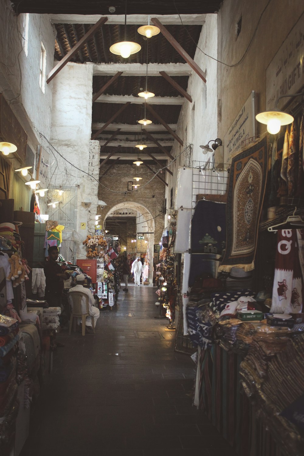 a narrow hallway with a lot of items on the floor