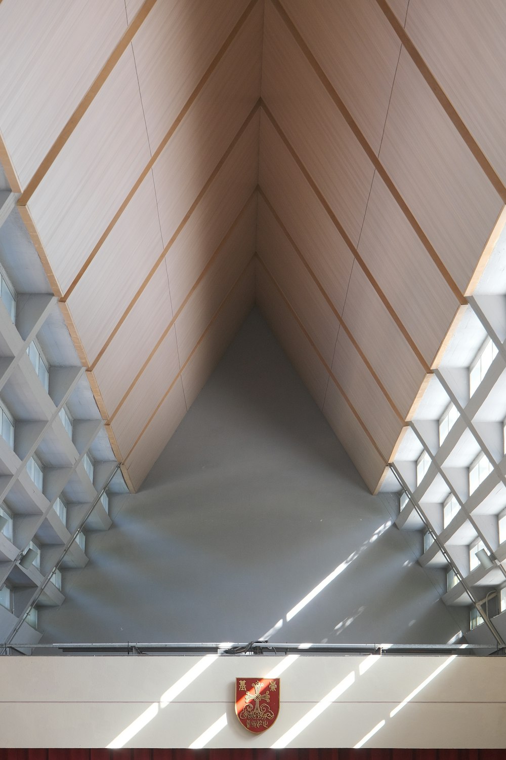 a building with a red and white shield on the wall