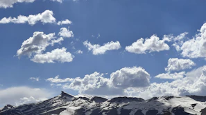 A scenic view of Chimborazo’s snowy peak under a clear blue sky