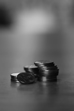 a stack of coins sitting on top of a table