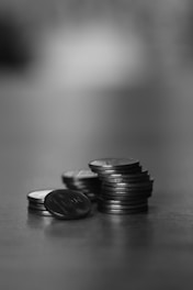 a stack of coins sitting on top of a table