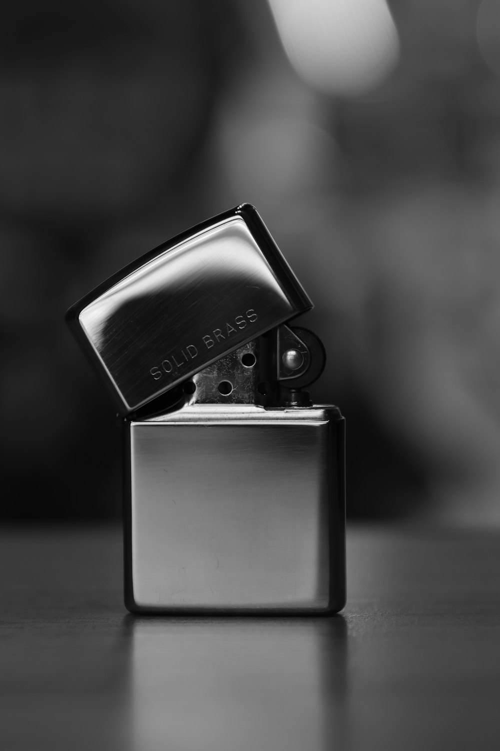 a black and white photo of a lighter