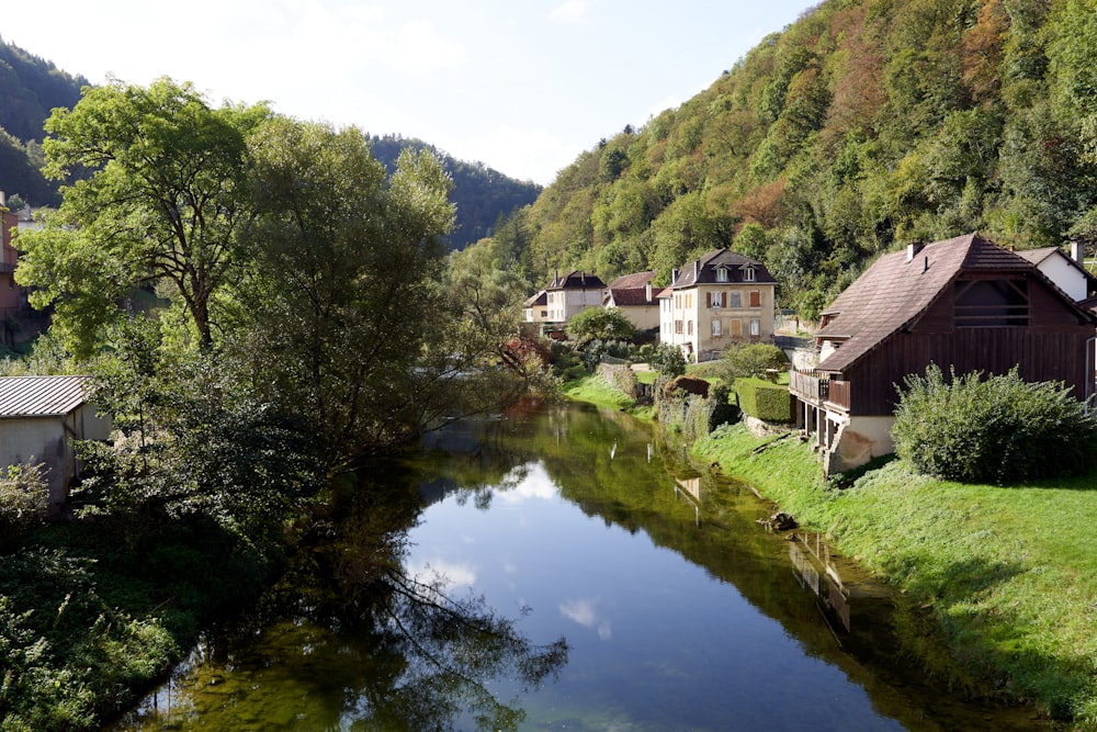 a river running through a lush green countryside