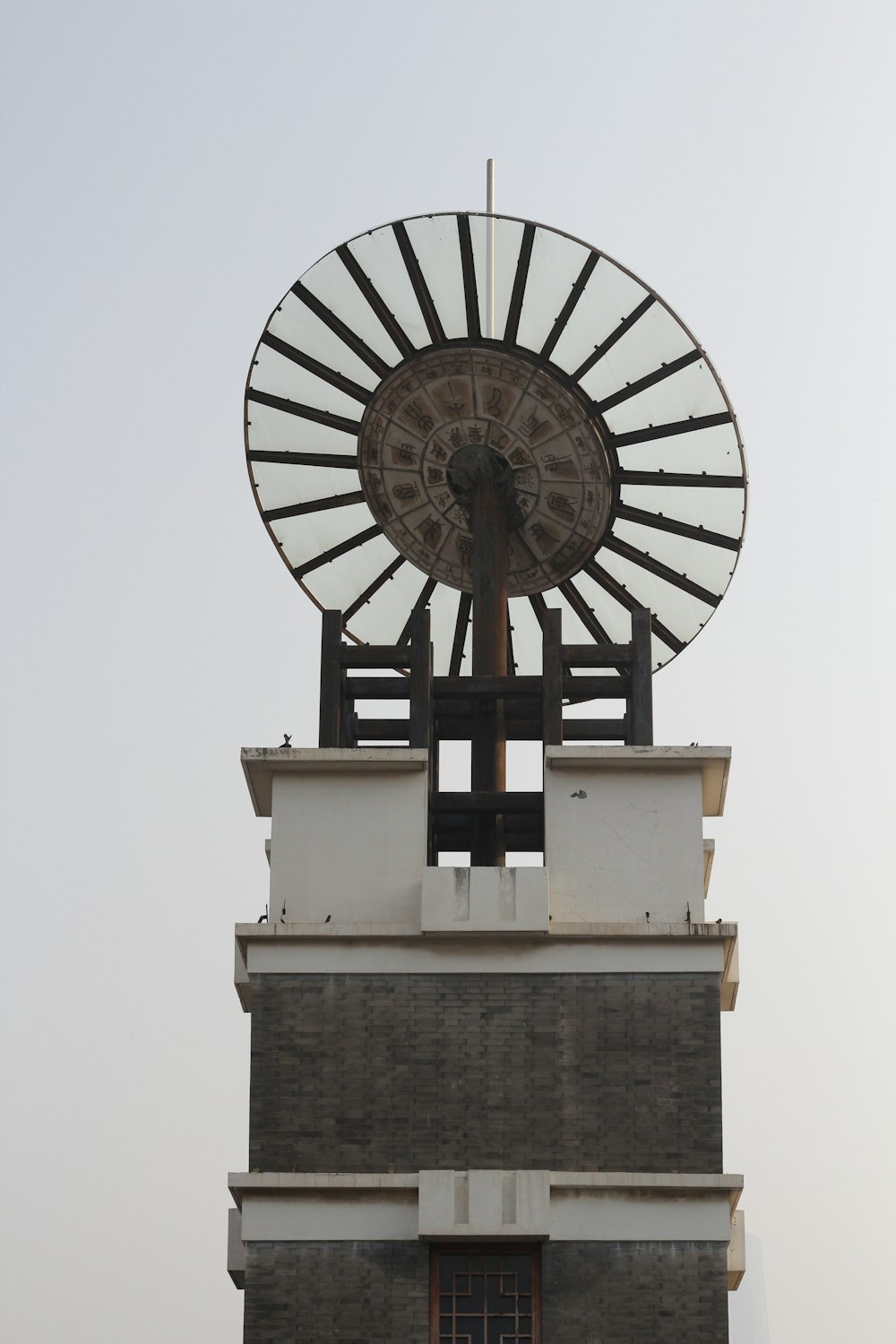 a large white and black clock on top of a building