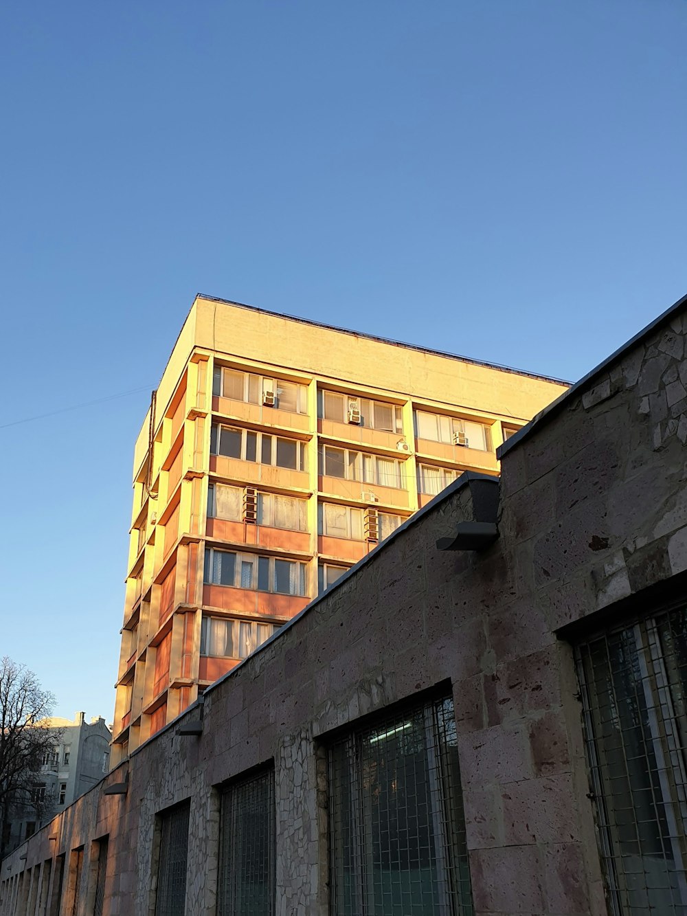 a very tall building sitting next to a tall building