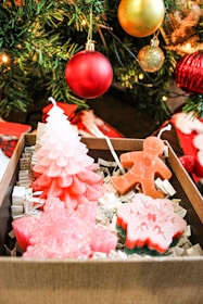 A beautifully arranged decorative item box featuring festive ornaments and ribbons.