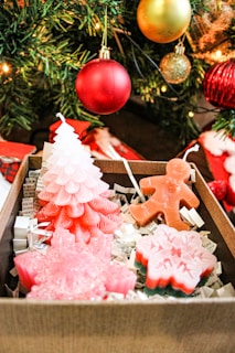 A collection of seasonal-themed wax melts displayed in a decorative box.