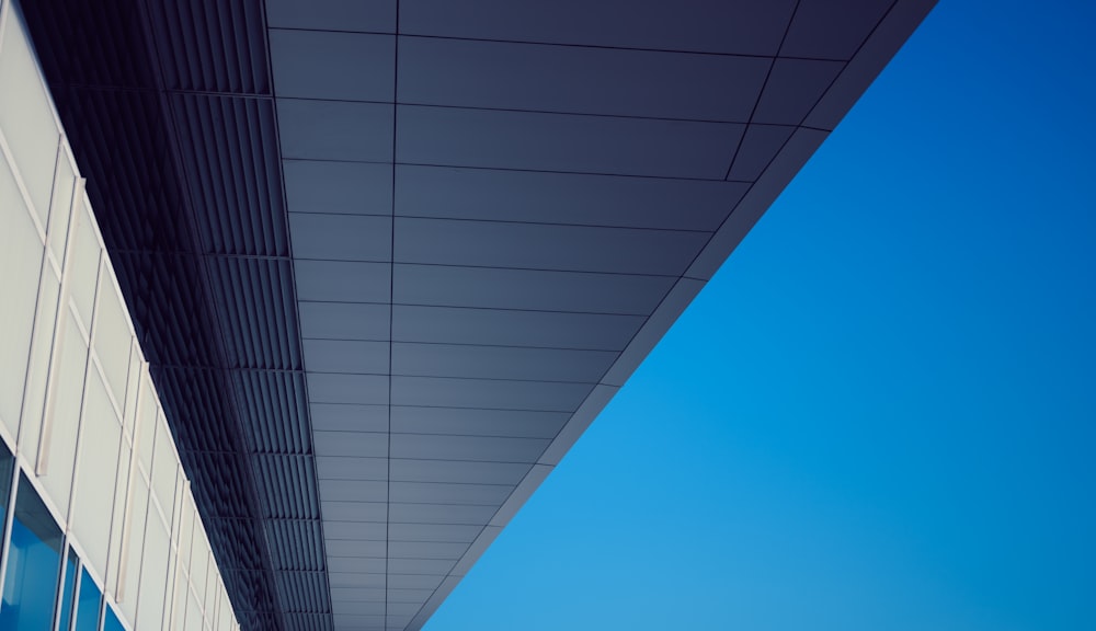 a tall building with a sky in the background